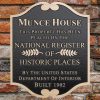 Cast bronze plaque indicating Munce House is on the National Register of Historic Places, built in 1902.