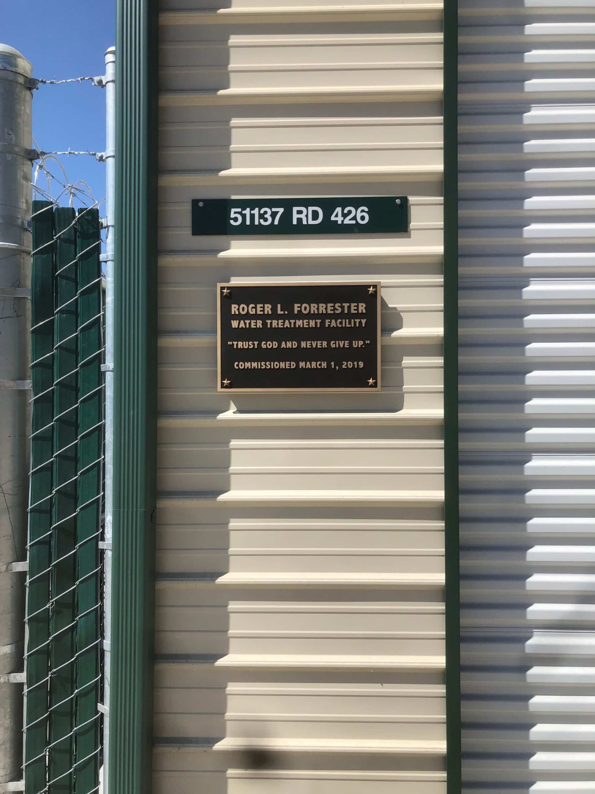 Cast bronze plaque installed at the Roger L Forrester Water Treatment Facility, Oakhurst, California