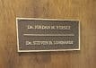 Exploring the Distinctions: Cast vs. Tooled Bronze Plaques