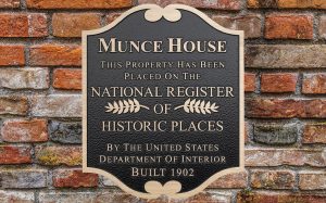 custom shape cast bronze plaque on brick