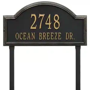 Black address sign displaying the number 2748 and the text 'OCEAN BREEZE DR.' in gold lettering.