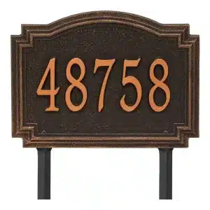 Bronze address plaque displaying the number 48758 in raised lettering on a textured background.