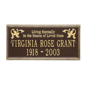 Bronze memorial plaque inscribed with 'Virginia Rose Grant 1918 - 2003' and decorative elements.