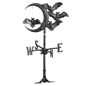 Decorative weather vane featuring three bats and a crescent moon design, indicating cardinal directions.