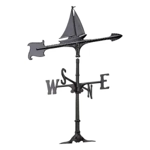 Black metal weather vane shaped like a sailboat with directional indicators for north, south, east, and west.