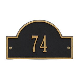 Arch Marker petite wall address plaque with arched frame shown mounted on an exterior wall